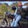 Kerri leaning against her loaded touring motorcycle on the way to Kakadu National Park