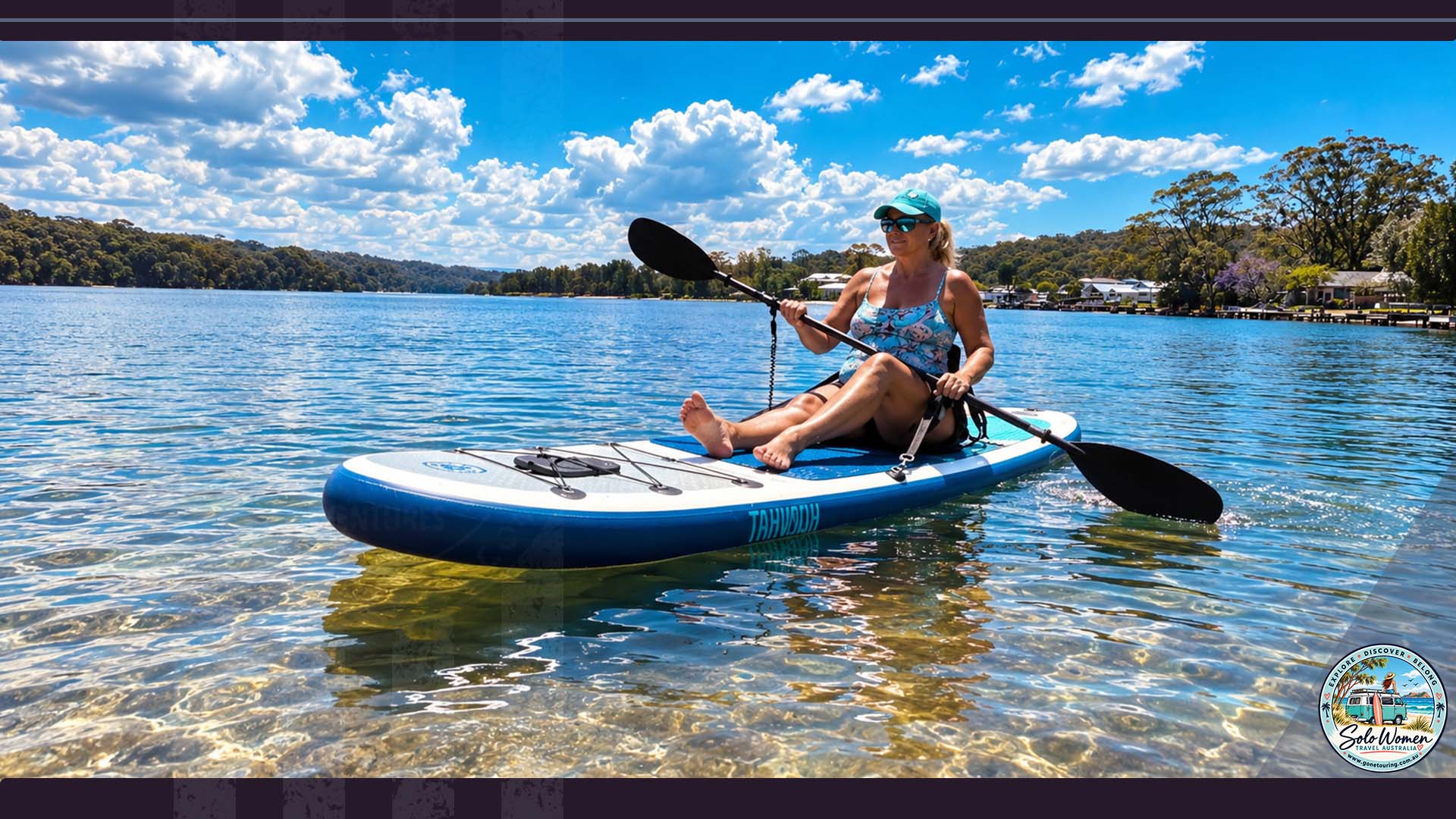 Kerri paddling a stand-up paddleboard fitted with a kayak seat during her SUP adventure.